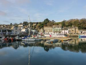 a group of boats are docked in a harbor at Newtrain Bay in Padstow