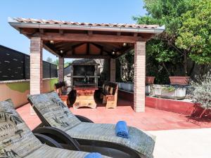 a patio with a pavilion with chairs and a table at Holiday Home Nika by Interhome in Kršan