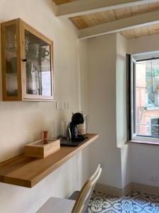 a kitchen with a counter and a window at Torre Anna Red in Riomaggiore +11 photos