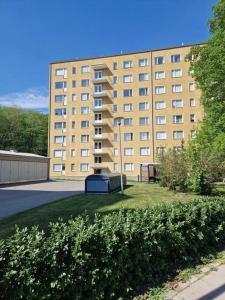 a large building with a grassy yard in front of a building at 50s Atmospheric Suite in Turku