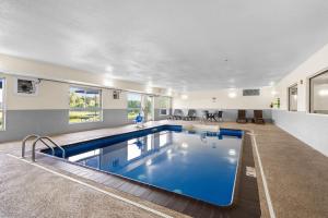 a large swimming pool in a house at Comfort Inn Hobart-Merrillville I-65 in Merrillville