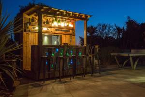 a group of chairs sitting in front of a building at 5 Bed House-Sleeps 14-Hot Tub-Bar-Garden-Parking in Tavistock