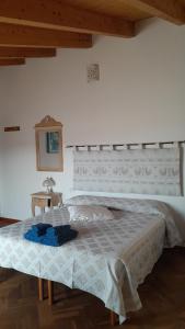 a bedroom with a bed with a white bedspread at B&B Nuovo Capo Altano in Portoscuso