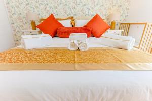 Postel nebo postele na pokoji v ubytování Cinnamon LakeHouse