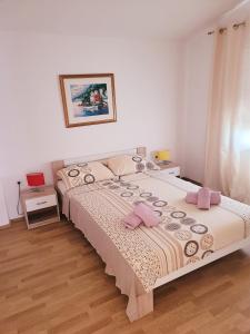 Posteľ alebo postele v izbe v ubytovaní Apartman Jopa