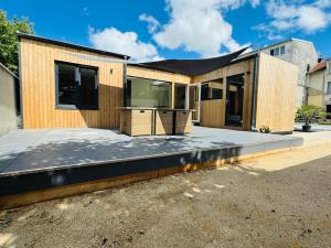 a house that is sitting on the side of a road at Chalet moderne animaux acceptés in Vittel