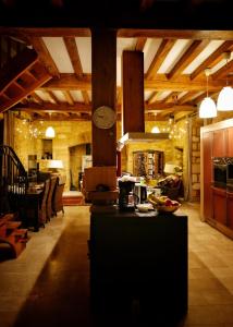 a large room with a kitchen and a living room at Les Constancies luxury Villa 24-34 pers in Valades +25 photos