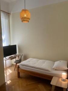 Postel nebo postele na pokoji v ubytování Hotel Villa Arnold