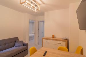 a living room with a couch and a table at Apartamento Holidea Ayuntamiento de Santander in Santander