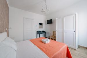 Postel nebo postele na pokoji v ubytování Franciacorta Rooms