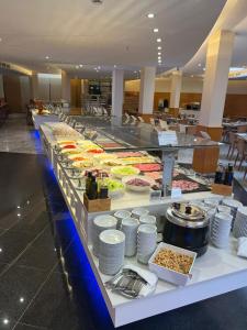 a buffet line with many different types of food at Hotel Madeira Centro in Benidorm
