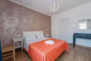 Postel nebo postele na pokoji v ubytování Franciacorta Rooms