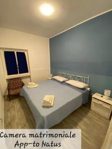 Ένα ή περισσότερα κρεβάτια σε δωμάτιο στο Marchisa Apartments