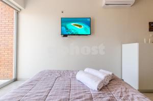Katil atau katil-katil dalam bilik di Comfortable Villa Morra Loft