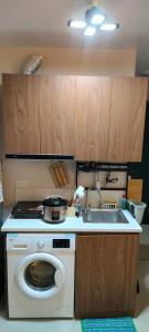 a kitchen with a washing machine and a sink at Idanna Staycation in Lapu Lapu City +10 photos
