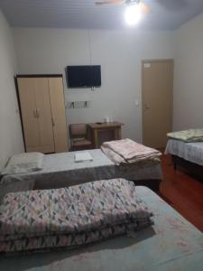 Postel nebo postele na pokoji v ubytování Pousada dos Viajantes