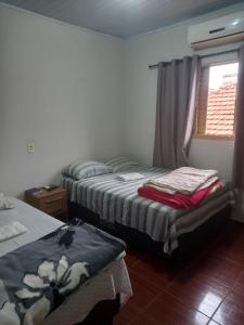 Postel nebo postele na pokoji v ubytování Pousada dos Viajantes