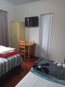 Postel nebo postele na pokoji v ubytování Pousada dos Viajantes