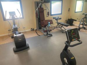 a gym with several exercise bikes and a treadmill at Hotel Madeira Centro in Benidorm