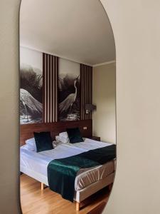 A bed or beds in a room at Thermal Hotel Visegrád