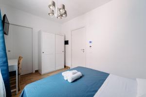 Postel nebo postele na pokoji v ubytování Franciacorta Rooms