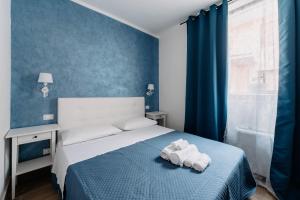 Postel nebo postele na pokoji v ubytování Franciacorta Rooms