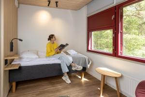 Ein Bett oder Betten in einem Zimmer der Unterkunft Hotel Linnasmäki