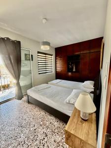 Postel nebo postele na pokoji v ubytování Traditional Corfiot House