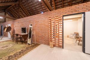 a brick wall with a door in a room at Stodola Humno 11 in Těšetice