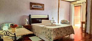 Cama ou camas em um quarto em Pousada Terraço Penedo