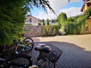 a group of bikes parked on a brick street at Apartament 2pokojowy 4-5osobowy in Węgorzewo