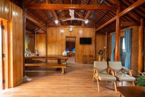 a dining room with a wooden table and chairs at Home of bong & gao in B'su M'rac