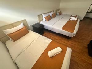 Hotel Embajada Bogota DC客房内的一张或多张床位