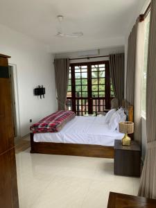 Letto o letti in una camera di Galkaduwa360 Villa