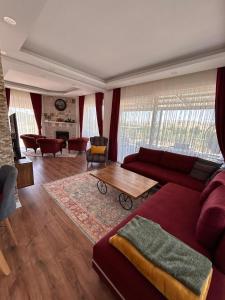 a living room with a couch and a table at GREEN VALLEY House in Avanos