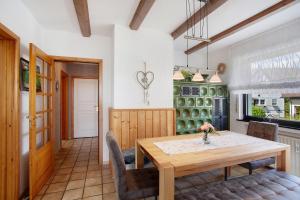 a dining room with a wooden table and chairs at Ferienwohnung Lux in Plettenberg