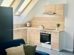 Η κουζίνα ή μικρή κουζίνα στο Apartamenty A&M