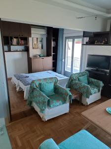 A kitchen or kitchenette at Lilioum Apartment