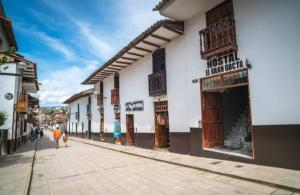 a group of people walking down a street at Hostal El Gran Gocta in Chachapoyas