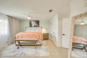 a bedroom with a bed and a mirror at Chic New Orleans Abode 1 Mi to Lake Pontchartrain in New Orleans