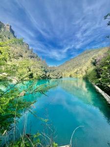 a blue lake in the middle of a valley at Alcova delle Arvolte in Narni +26 photos