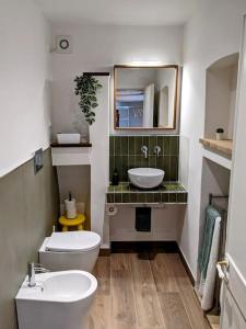 a bathroom with a toilet and a sink at Alcova delle Arvolte in Narni +26 photos