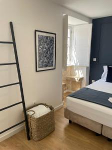Cama ou camas em um quarto em Casa do Museu