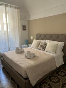 Postel nebo postele na pokoji v ubytování Immacolata Rooms