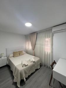 Łóżko lub łóżka w pokoju w obiekcie Como en casa en el centro de Torrejón