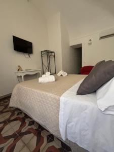 Postel nebo postele na pokoji v ubytování Immacolata Rooms