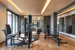 a gym with several treadmills and cardio machines at NK | Vila Mariana | Localização Perfeita in São Paulo