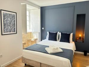Cama ou camas em um quarto em Casa do Museu