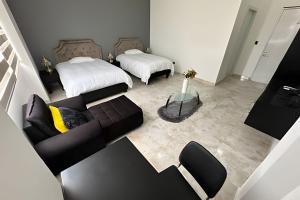 Voodi või voodid majutusasutuse Rio-ApartaHotel-Centro toas