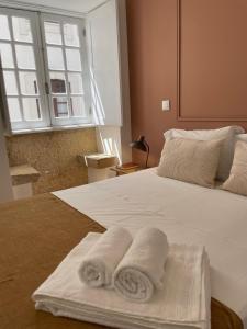 Cama ou camas em um quarto em Casa do Museu